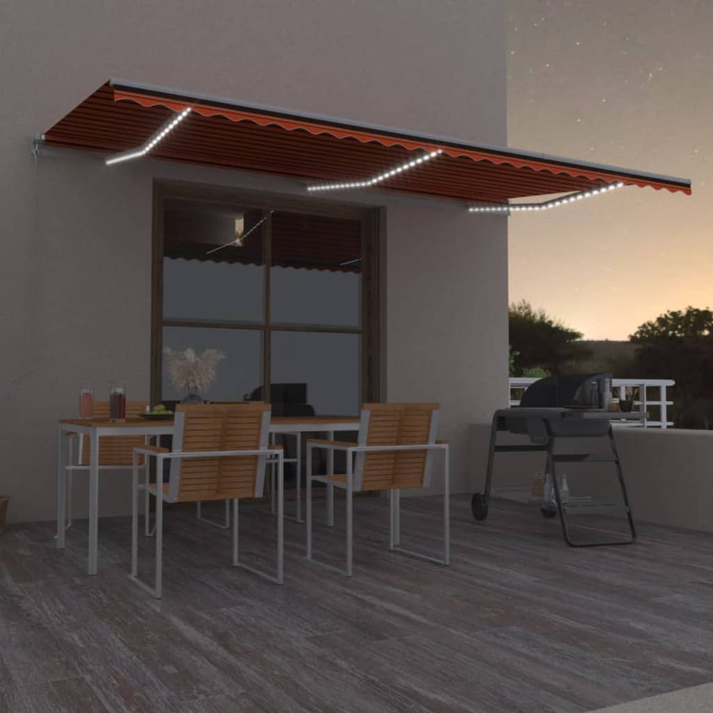 Manuell uttrekkbar markise med LED 600x300 cm oransje og brun
